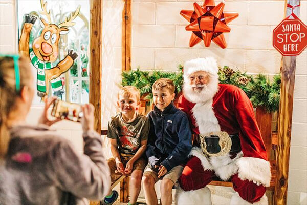 Santa & Two Kids Getting Photo Taken